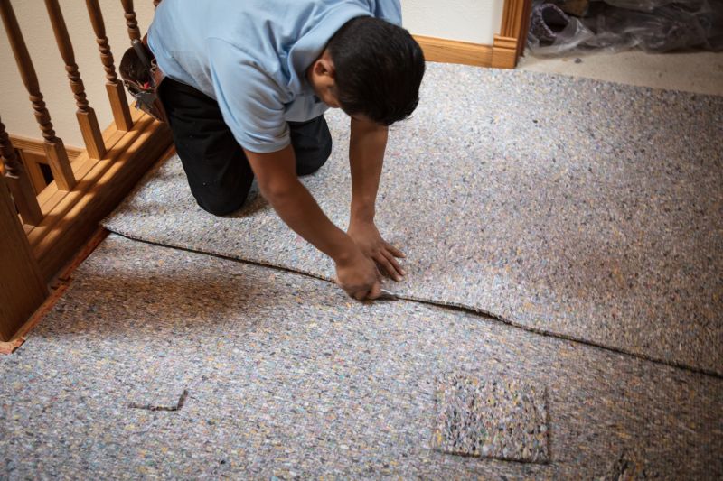 Professional Carpet Installer at Work